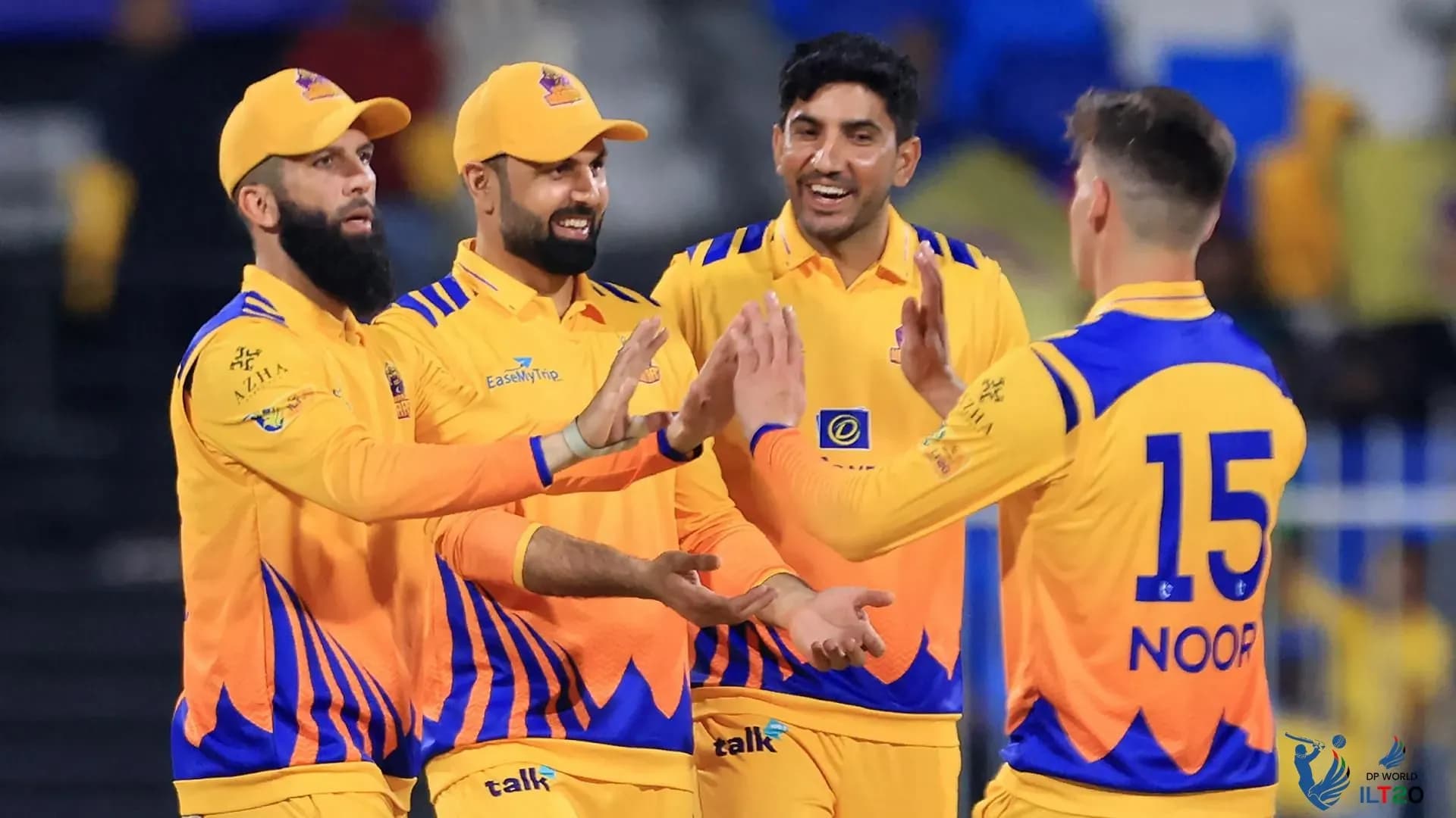 Cricket players celebrating together
